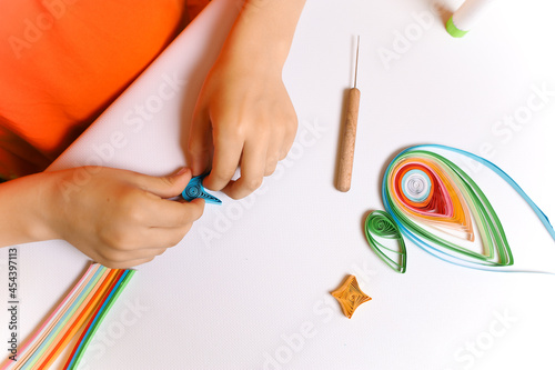 Quilling technique. Making decorations or greeting card