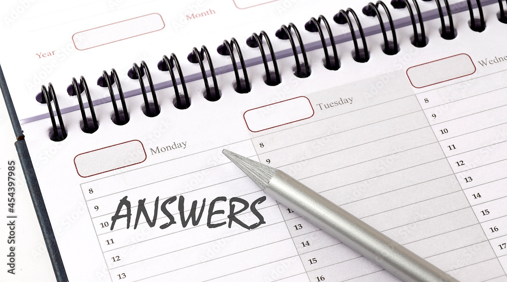 The words ANSWER written on a calendar planner to remind The words ANSWER written on a calendar planner to remind