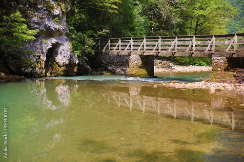 a wooden bridge over the river kupa in risnjak national park photo