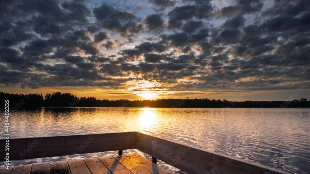 4K Time lapse of Majestic sunset or sunrise landscape. Water reflection of Amazing light of nature cloudscape sky and Clouds moving away rolling 4k colorful dark sunset 4K Time lapse of Majestic sunset or sunrise landscape. Water reflection of Amazing light of nature cloudscape sky and Clouds moving away rolling 4k colorful dark sunset