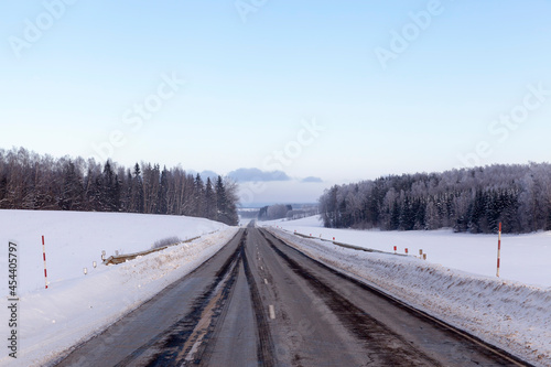 paved road covered with snow in winter © rsooll