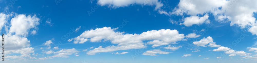 Obraz premium Blue Sky background with tiny Clouds. Panorama background