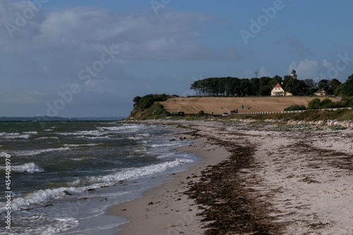 View to Drejet beach with the lighthouse Kegnaes Fyr	 on the Danish island of Alsen photo