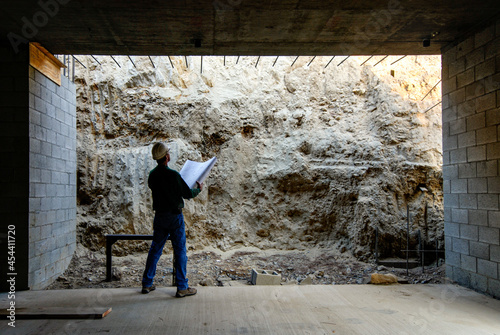 Contractor checking the plans to the existing conditions on a large foundation project