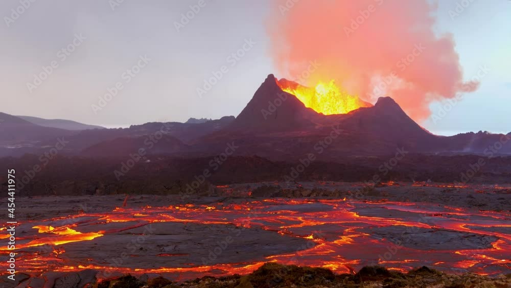 Amazing ground level shot of Iceland Fagradalsfjall volcano eruption with molten lava fields in motion foreground.