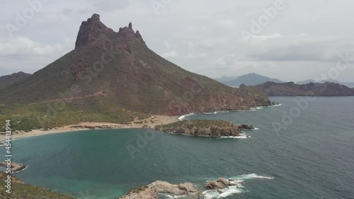 Aerial panoramic view of San Carlos bay in Sonora, Mexico. Cerro Tetakawi as background with the drone slowly ascending.