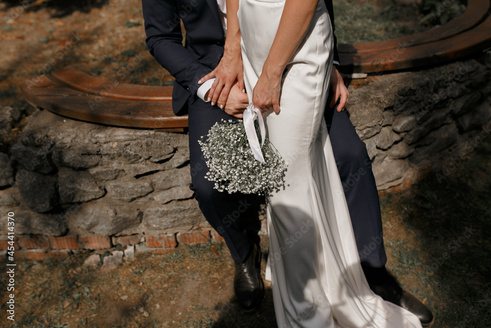 Wedding bouquet in the hands of the bride. Wedding bouquet in the hands of the bride.