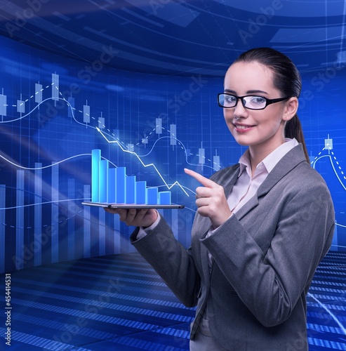Businesswoman in stock trading business concept