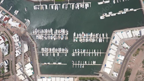 Aerial top down view over Marina Real in San Carlos, Sonora, Mexico. Drone slowly descending.