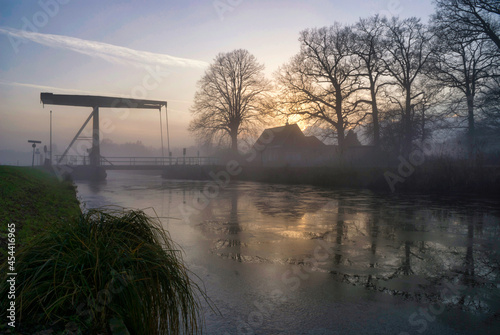 Bridge over a frozen canal photo