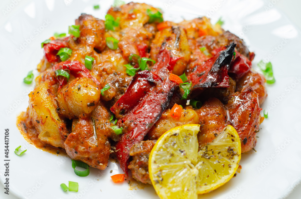 Tuscan style sauce with gnocchi, pork and beef meatballs and grilled red peppers garnished with fresh parsley and chive Tuscan style sauce with gnocchi, pork and beef meatballs and grilled red peppers garnished with fresh parsley and chive
