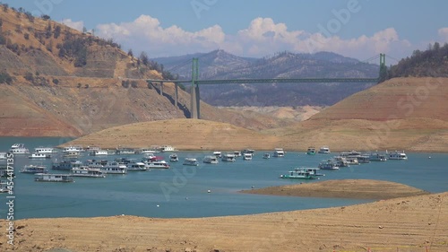2021 - Oroville Lake California during extreme drought conditions with low water levels and burned trees. photo