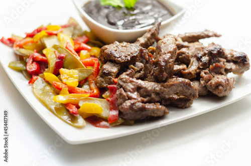 Beef strips with mixed peppers and mangetout served with black bean sauce