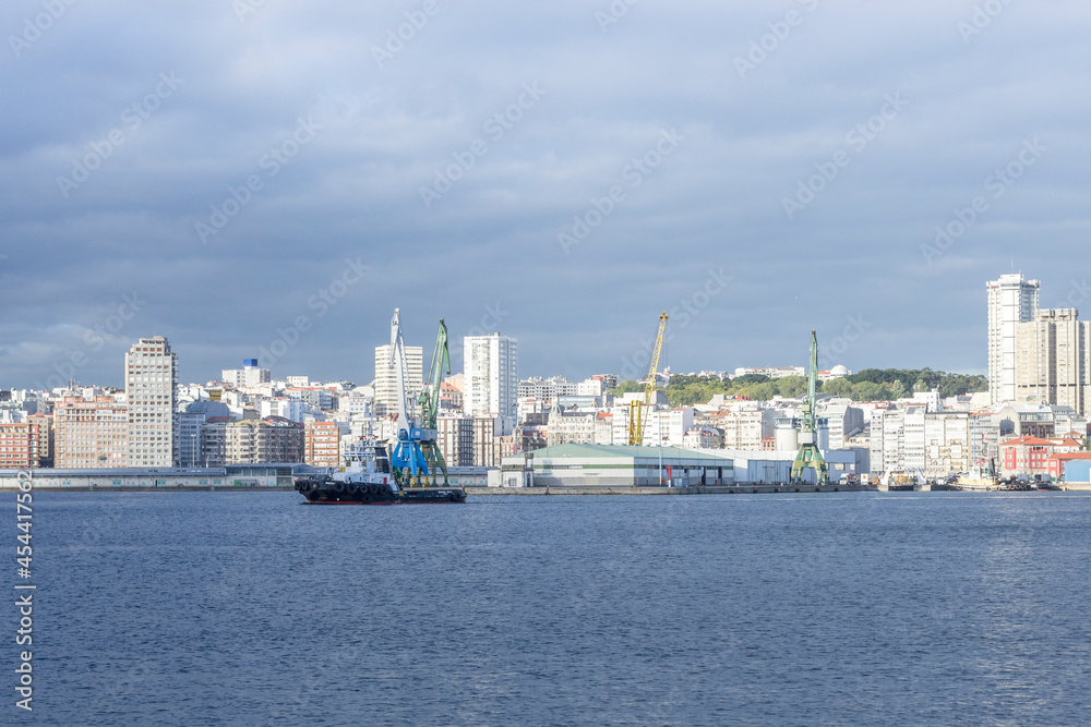 Coruna, Spain. 10-01-2018. View of the seaport of the city of Coruna with its cranes and ships. High quality photo