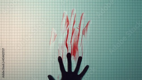 hand smearing blood on window brutal murder mysterious death concept photo