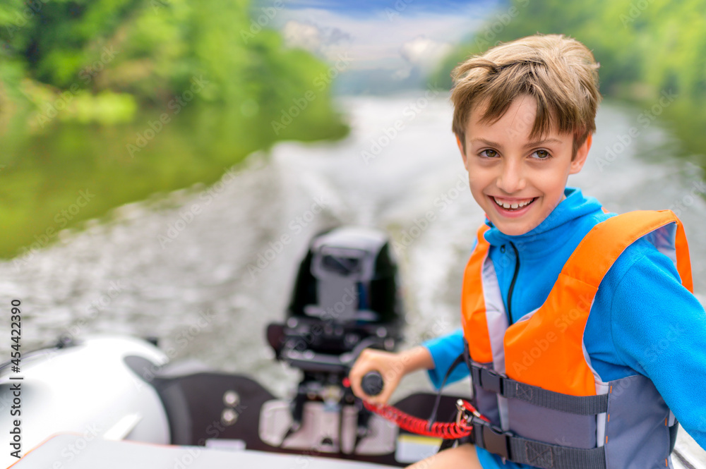 Little Boy Driving the Motorboat Little Boy Driving the Motorboat