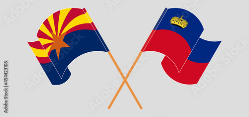 Crossed and waving flags of the State of Arizona and Liechtenstein