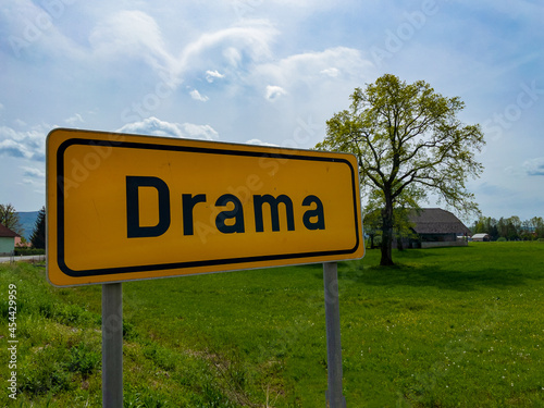 CLOSE UP: A yellow traffic sign indicates you are entering the town of Drama