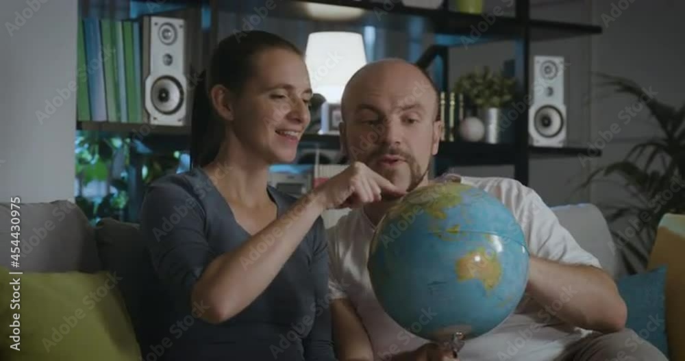 Happy couple searching for new destinations for their travels Happy couple searching for new destinations for their travels