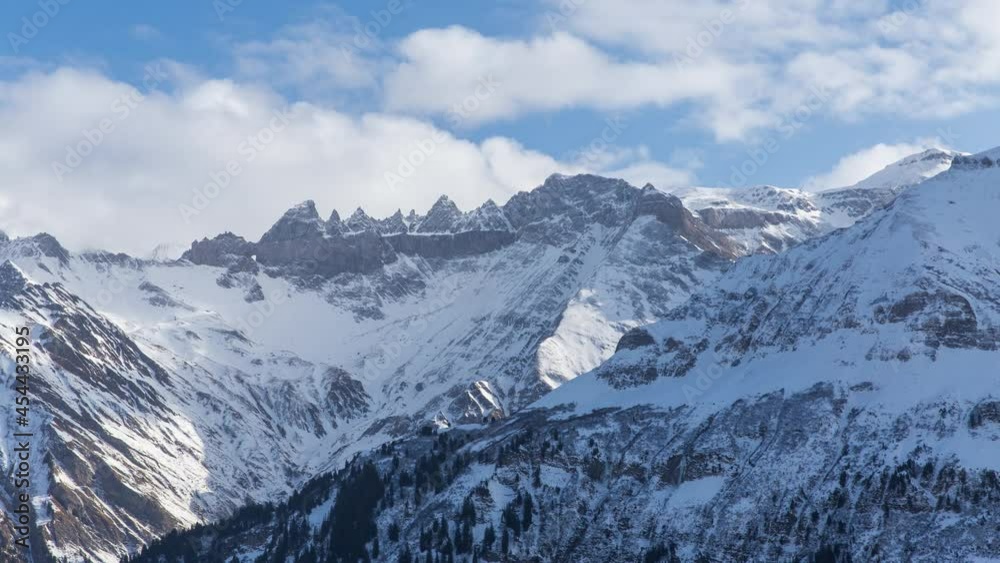 custom made wallpaper toronto digitalTime lapse snowy mountains. Snow covered rocks and boulders under a blue sky. Elm. Switzerland.