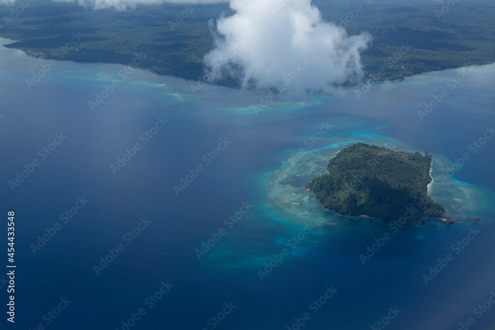 Aerial view from plane, of coastal landscape in Kapatlap area, arriving at Sorong airport in West Papua province, Indonesia