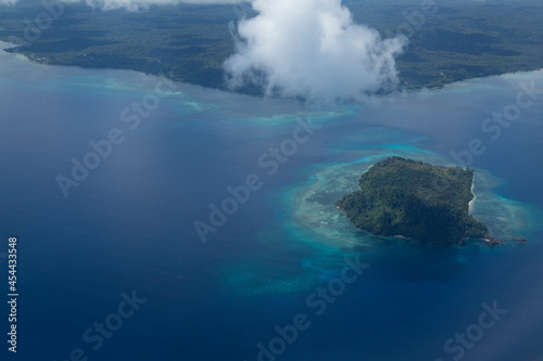Aerial view from plane, of coastal landscape in Kapatlap area, arriving at Sorong airport in West Papua province, Indonesia © Alvaro