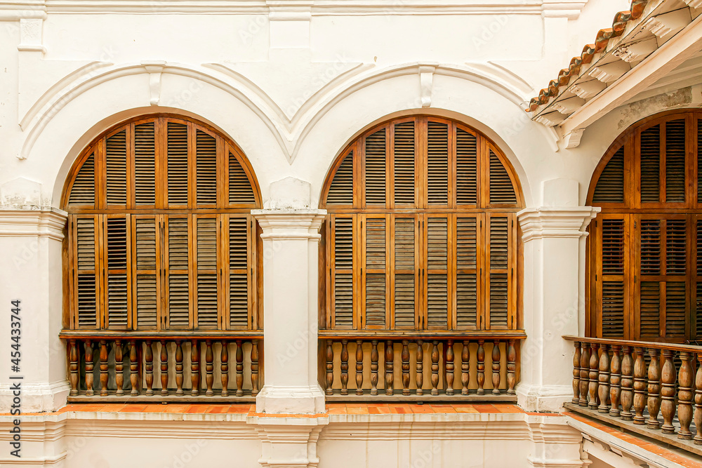 Big beautiful brown colonial windows.