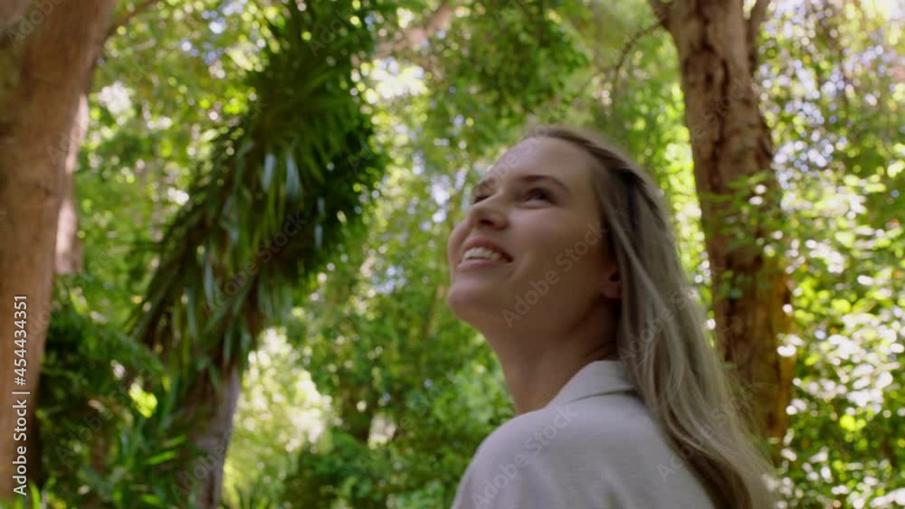 beautiful woman walking in forest nature girl exploring lush garden enchanted by natural beauty outdoors 4k beautiful woman walking in forest nature girl exploring lush garden enchanted by natural beauty outdoors 4k
