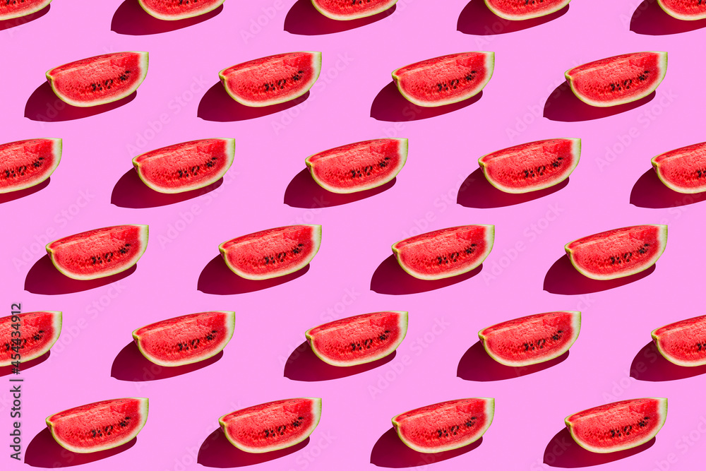 Top view of watermelon slices on pink background. Watermelon colorful pattern Top view of watermelon slices on pink background. Watermelon colorful pattern