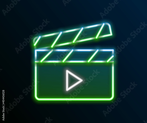 Glowing neon line Movie clapper icon isolated on black background. Film clapper board. Clapperboard sign. Cinema production or media industry. Colorful outline concept. Vector
