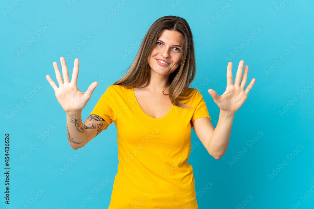 Young slovak woman isolated on blue background counting ten with fingers Young slovak woman isolated on blue background counting ten with fingers