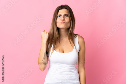 Young slovak woman isolated on pink background with unhappy expression