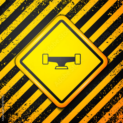 Black Skateboard wheel icon isolated on yellow background. Skateboard suspension. Skate wheel. Warning sign. Vector