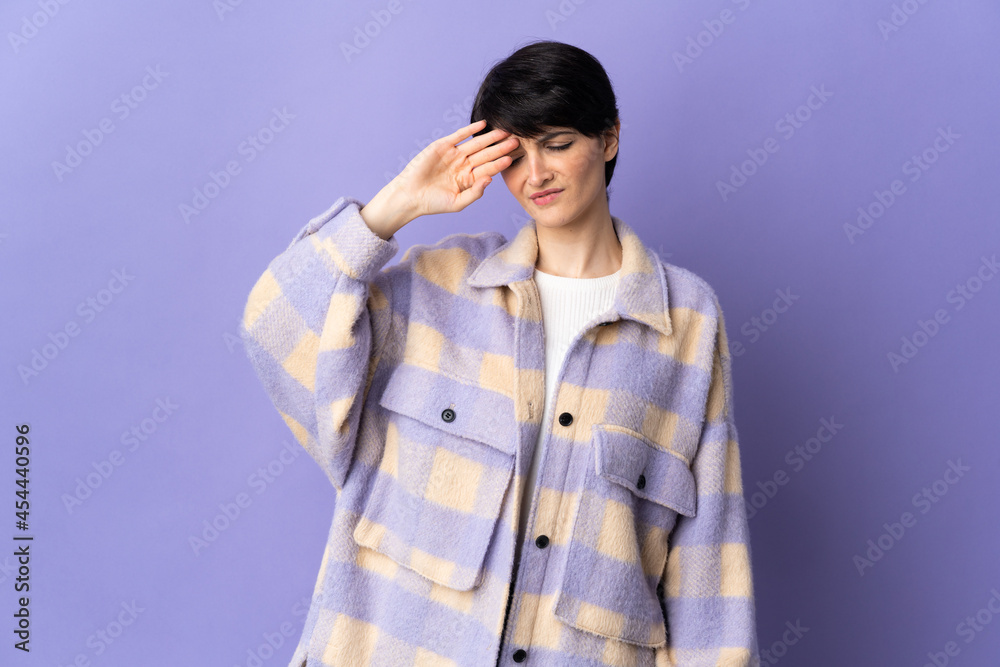Fototapeta premium Woman with short hair isolated on purple background with tired and sick expression