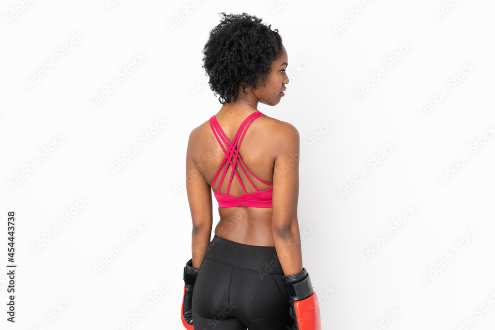 Young African American woman isolated on white background with boxing gloves