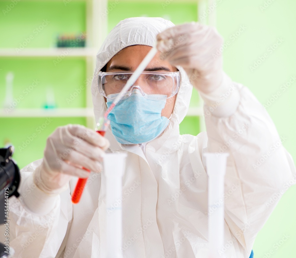 Chemist working in the lab on new experiment Chemist working in the lab on new experiment