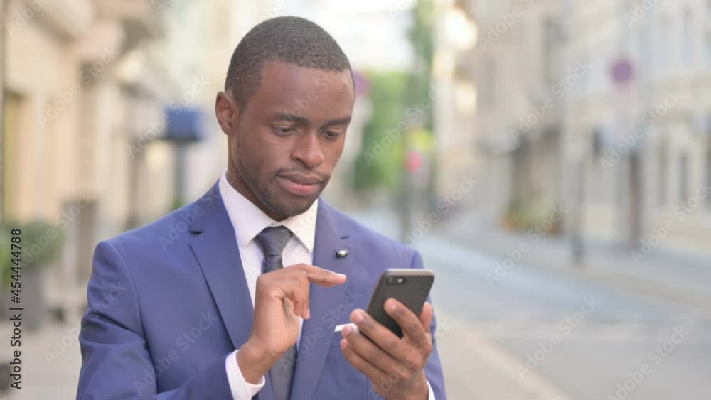 Outdoor African Businessman using Smartphone Outdoor African Businessman using Smartphone