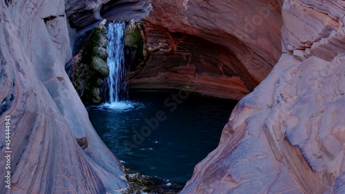 zoom out clip of the famous spa pool and waterfall at karijini national park in western australia photo