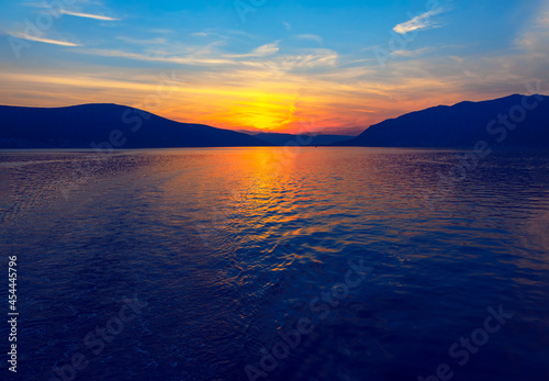 Sunset over the water bay and mountain 
