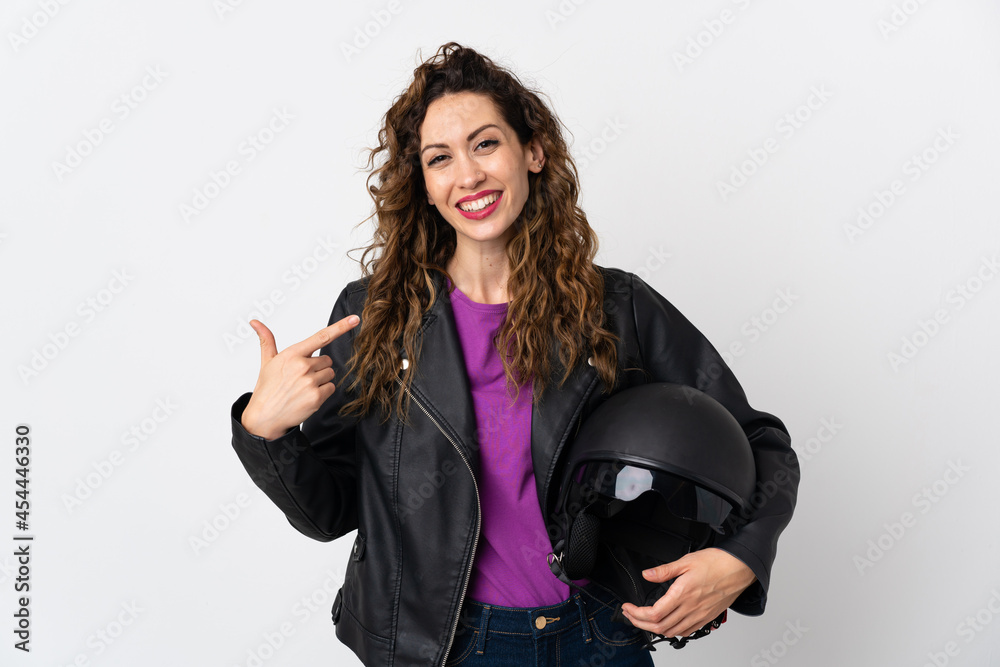 Young caucasian woman holding a motorcycle helmet giving a thumbs up gesture Young caucasian woman holding a motorcycle helmet giving a thumbs up gesture
