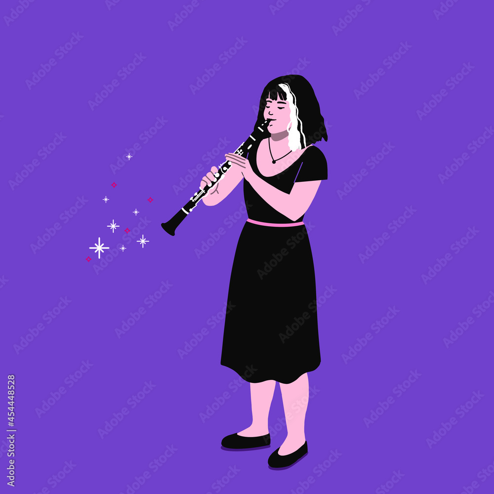 Clarinet player.  professional musician playing the clarinet.  female playing wind instrument on stage.  classical music playing.  live orchestra music concert. 