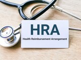 HRA written on white card stand for Health Reimbursement Arrangement.
