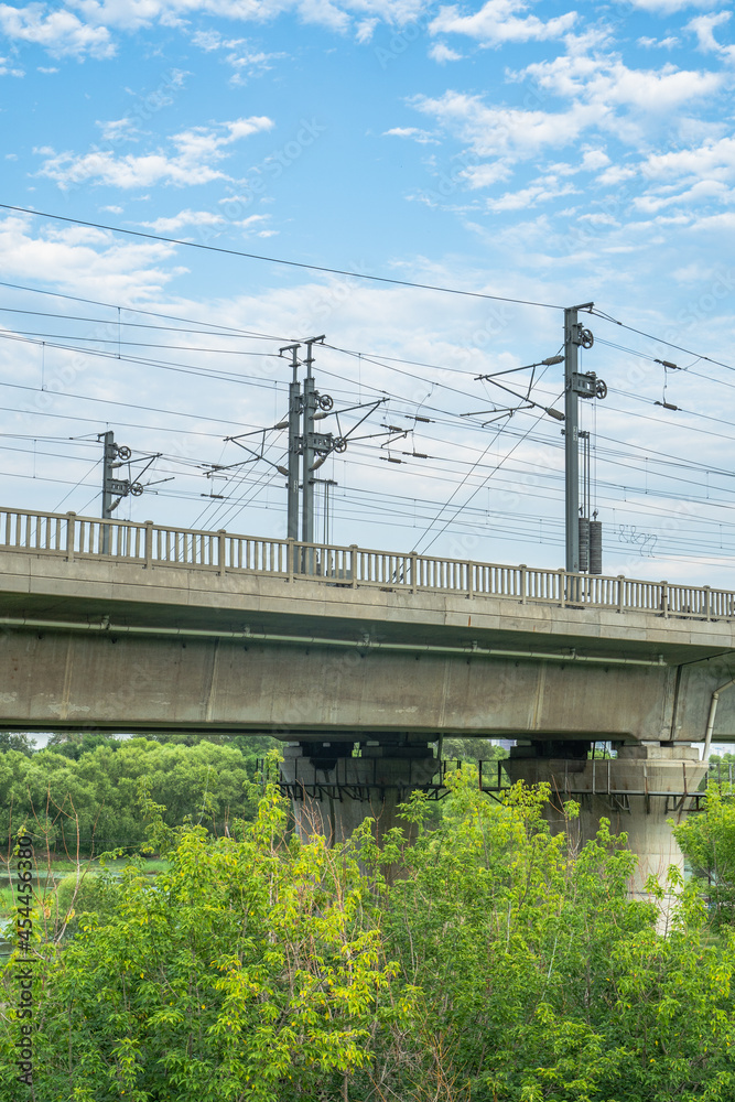 Close view of railroad bridge under blue sky. Close view of railroad bridge under blue sky.