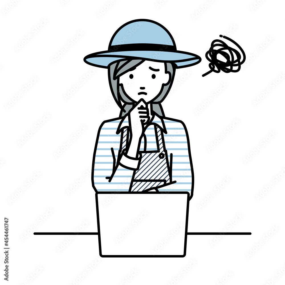 デスクで座ってPCを開いて困っている農家の女性 デスクで座ってPCを開いて困っている農家の女性
