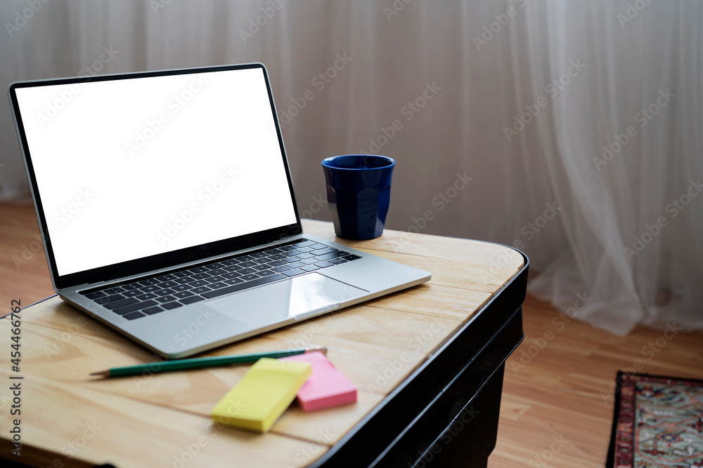 Naklejka premium Close up view of home office desk with laptop