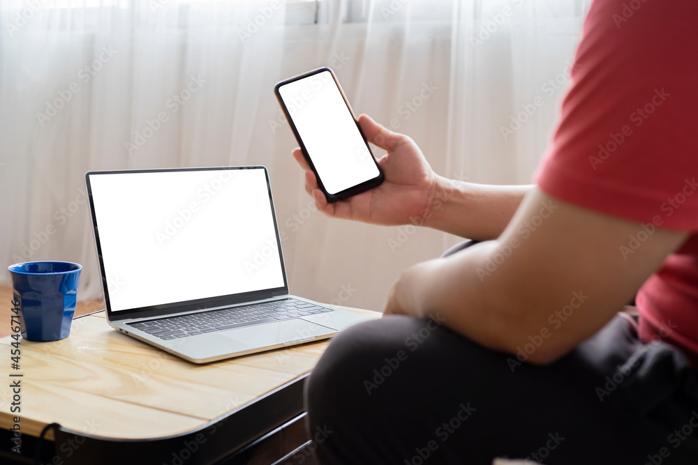 Fototapeta premium mockup image computer,cell phone blank screen for hand typing text