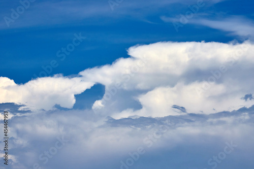 the fluffy clouds floating on blue sky