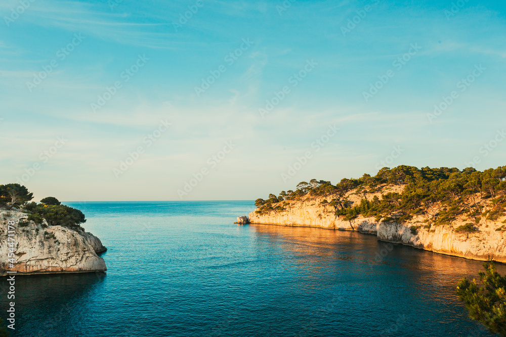 Calanques, Cote de Azur, France. Beautiful nature of Calanques on the azure coast of France. Calanques - a deep bay surrounded by high cliffs. Landscape in sunrise light during Sunny summer morning