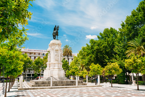 Monument to King Saint Ferdinand at New Square Plaza Nueva) in Seville, Spain.