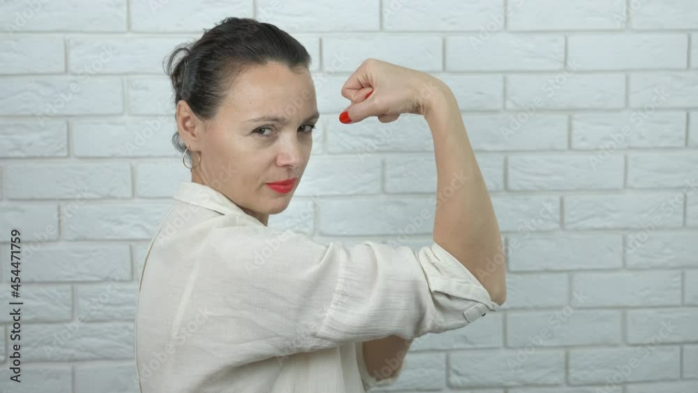 Strong feminist. The woman shows a strong hand. Strong feminist. The woman shows a strong hand.